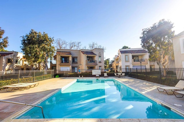 view of pool featuring a patio