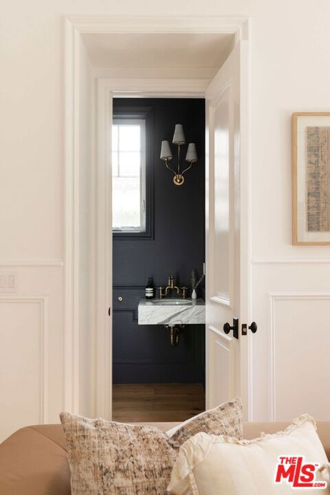 bathroom with sink and hardwood / wood-style floors