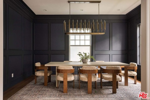 dining room with wood-type flooring