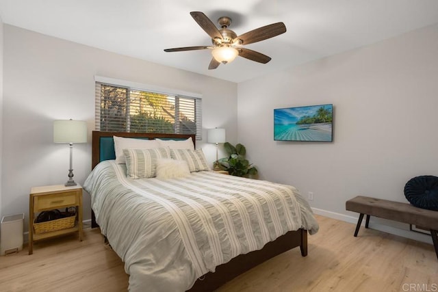 bedroom featuring light hardwood / wood-style flooring and ceiling fan