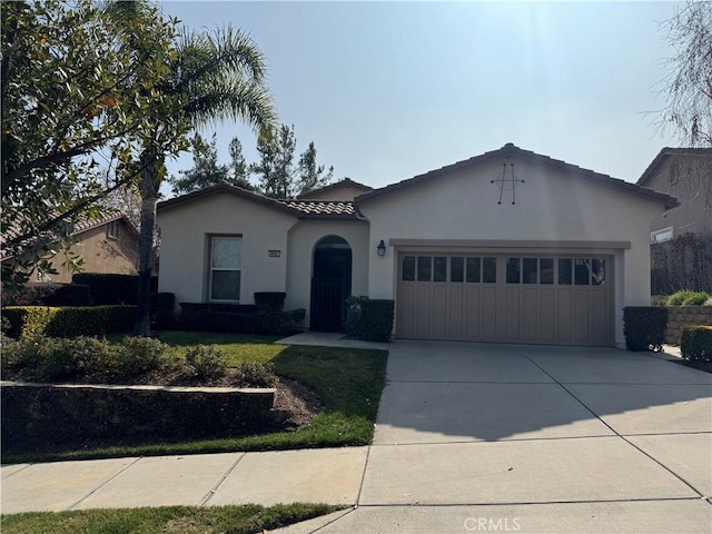 9431 Hughes Dr, Corona, CA 92883 - ranch-style home featuring a garage, concrete driveway, a tile roof, and stucco siding