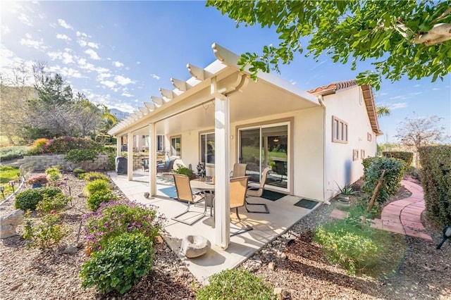 9431 Hughes Dr, Corona, CA 92883 - rear view of house featuring a patio and stucco siding