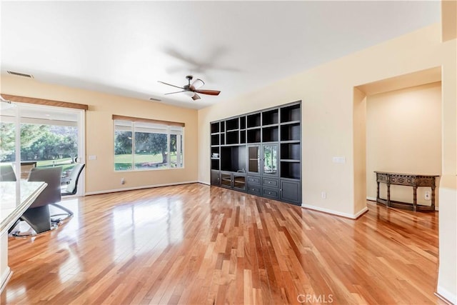 9431 Hughes Dr, Corona, CA 92883 - unfurnished living room with light wood-style floors, visible vents, baseboards, and a ceiling fan