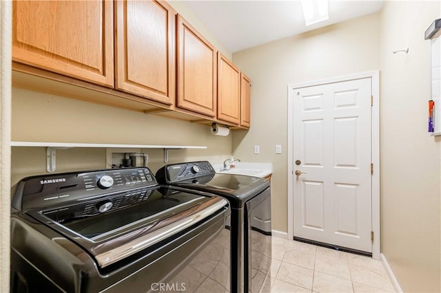 9431 Hughes Dr, Corona, CA 92883 - laundry area with cabinet space, a sink, baseboards, and separate washer and dryer