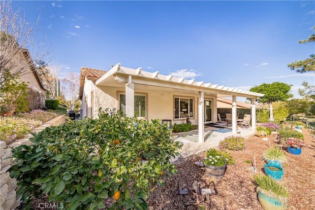 9431 Hughes Dr, Corona, CA 92883 - rear view of house featuring a tile roof, a patio, a pergola, and stucco siding