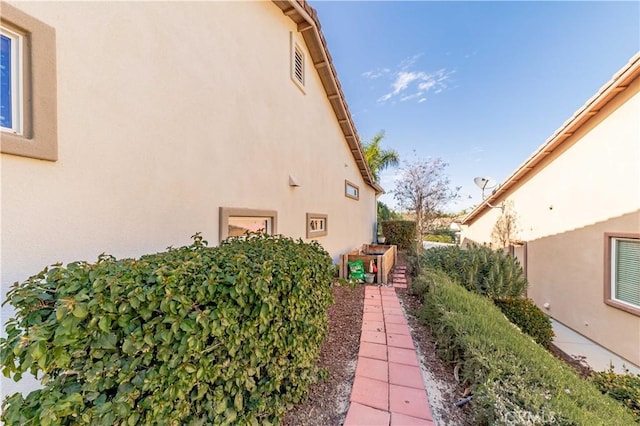 9431 Hughes Dr, Corona, CA 92883 - view of side of home with stucco siding