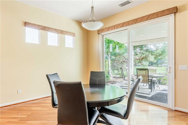9431 Hughes Dr, Corona, CA 92883 - dining area featuring light wood finished floors, baseboards, and visible vents
