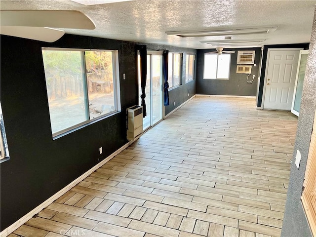 hall with a textured ceiling