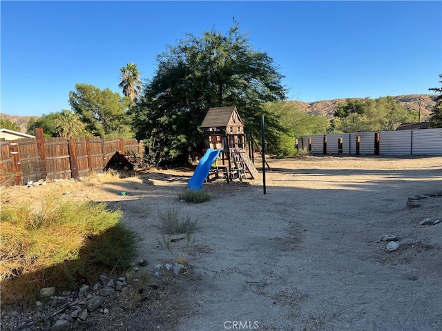 view of play area featuring a mountain view