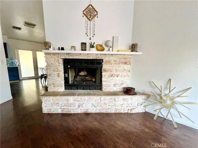 room details featuring a fireplace and hardwood / wood-style floors