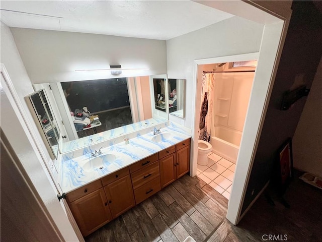 full bathroom featuring hardwood / wood-style flooring, vanity, shower / bathtub combination with curtain, and toilet