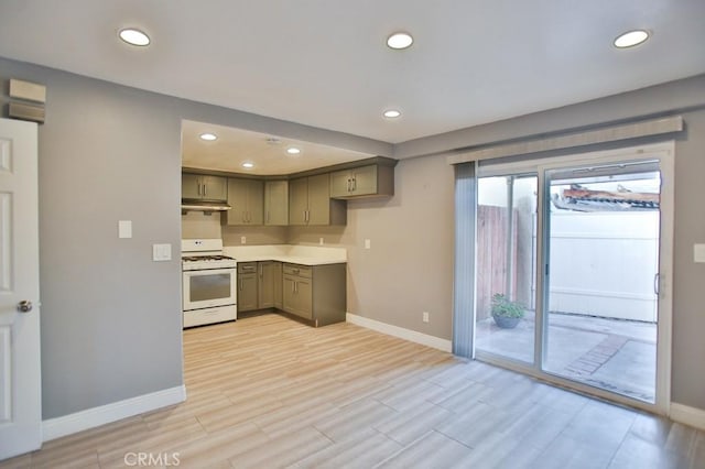 kitchen with light hardwood / wood-style floors, white range with gas stovetop, and gray cabinetry