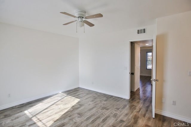 unfurnished room featuring ceiling fan and wood-type flooring