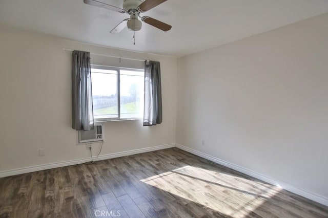 unfurnished room with hardwood / wood-style floors, a wall unit AC, and ceiling fan