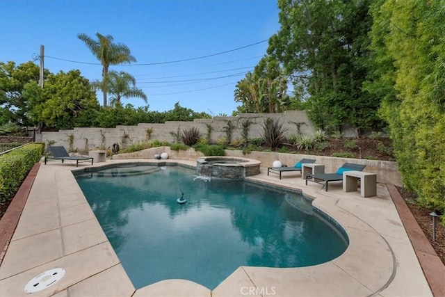 view of swimming pool featuring an in ground hot tub and a patio