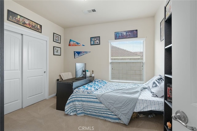 carpeted bedroom featuring a closet