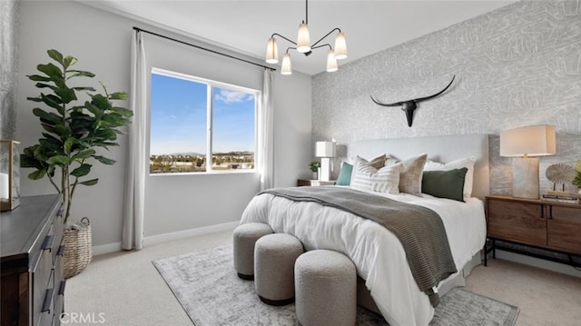 carpeted bedroom featuring an inviting chandelier