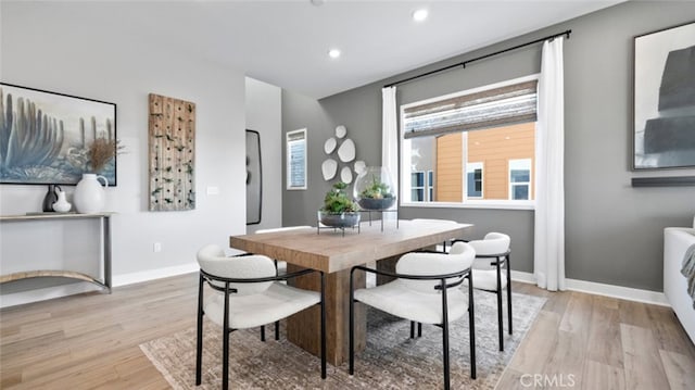 dining space with light wood-type flooring