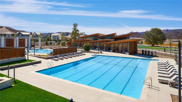 view of pool featuring a patio