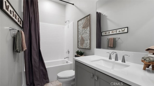 full bathroom featuring shower / bath combo, vanity, and toilet