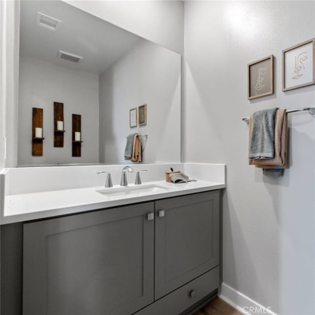 bathroom featuring vanity and hardwood / wood-style floors