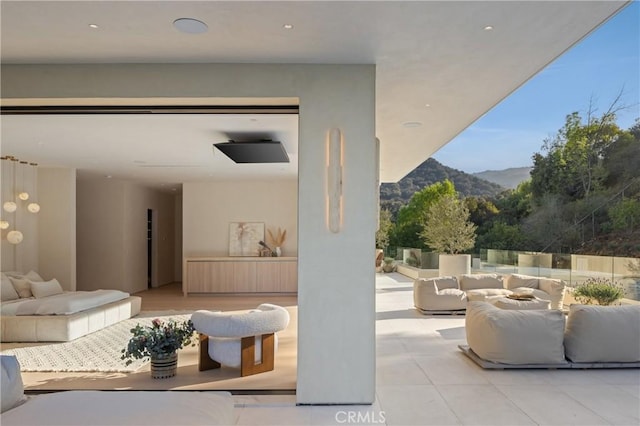 view of patio featuring a mountain view and an outdoor hangout area