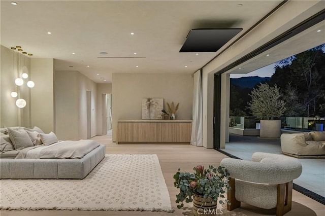 interior space featuring access to outside, light wood-style flooring, and recessed lighting