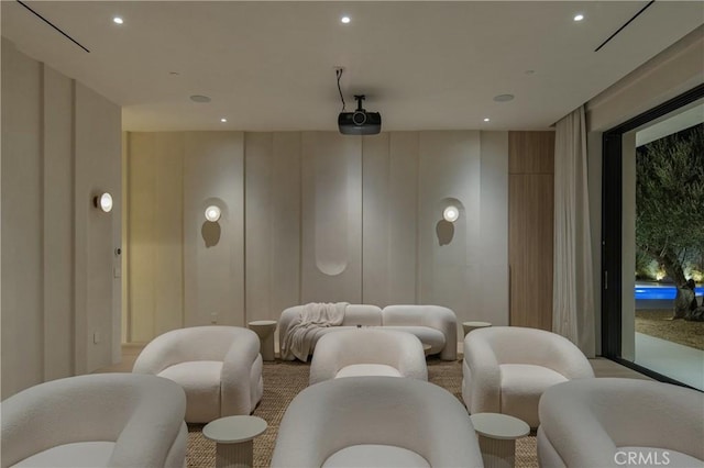 cinema room with a decorative wall and recessed lighting