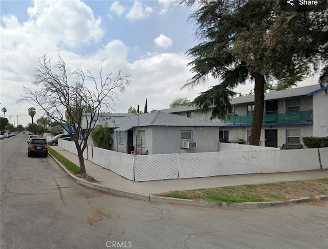 view of side of property with cooling unit