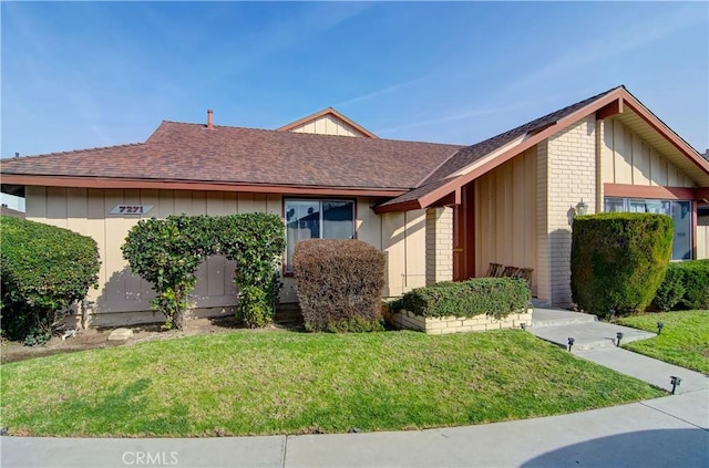 view of home's exterior with a lawn