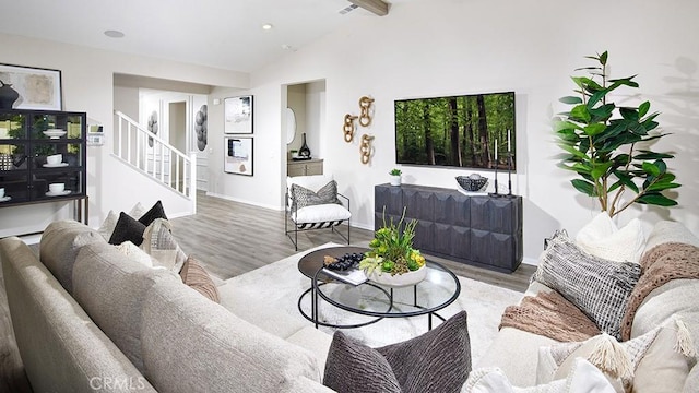 living room with wood-type flooring and vaulted ceiling