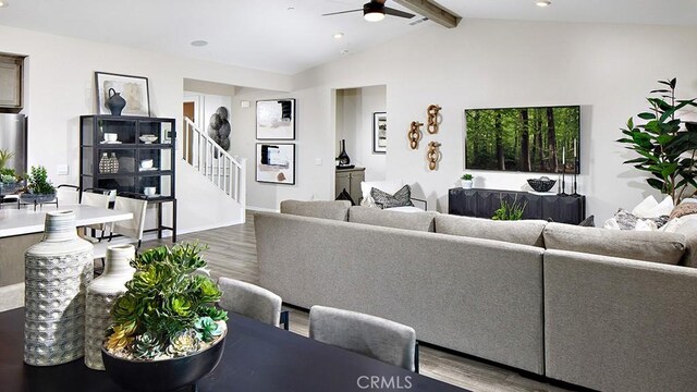 living room featuring vaulted ceiling with beams, wood-type flooring, and ceiling fan