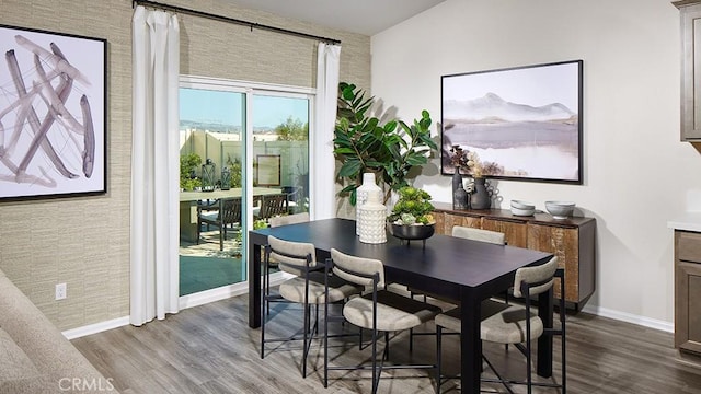 dining room with hardwood / wood-style flooring