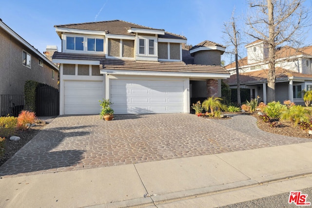 front of property with a garage