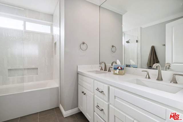 bathroom featuring tile patterned flooring, vanity, and tiled shower / bath combo