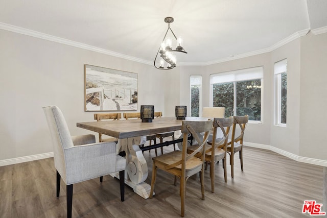 dining area featuring an inviting chandelier, crown molding, and wood-type flooring