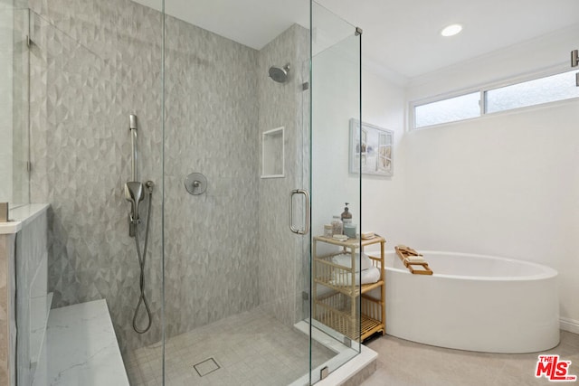 bathroom featuring crown molding, independent shower and bath, and tile patterned flooring