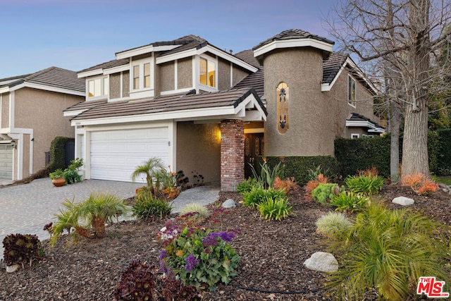 view of front of home with a garage