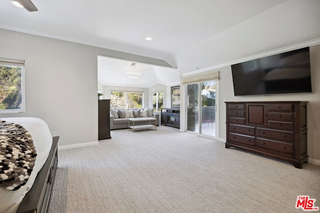 bedroom with lofted ceiling, crown molding, access to outside, and light colored carpet