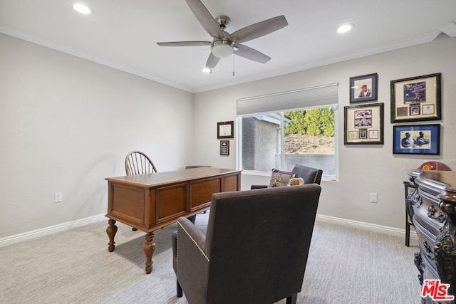 office space featuring crown molding, light colored carpet, and ceiling fan