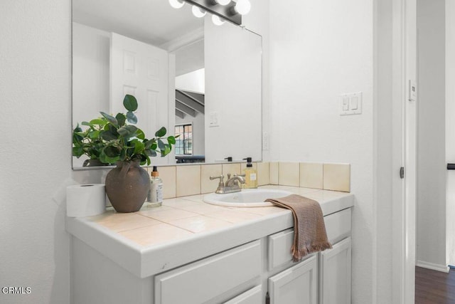 bathroom featuring vanity and hardwood / wood-style floors