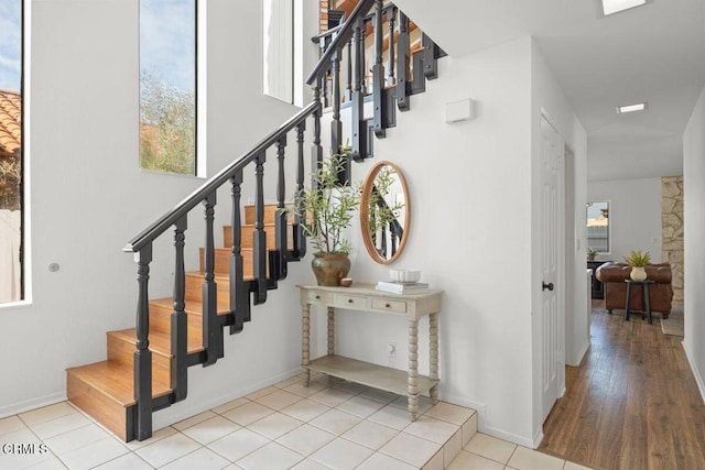 stairs featuring tile patterned floors