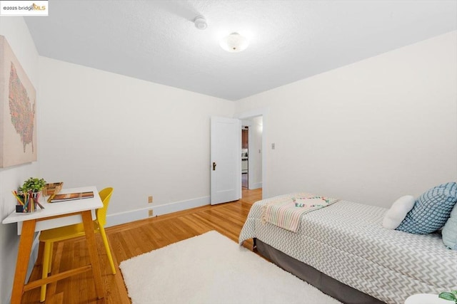 bedroom featuring hardwood / wood-style floors