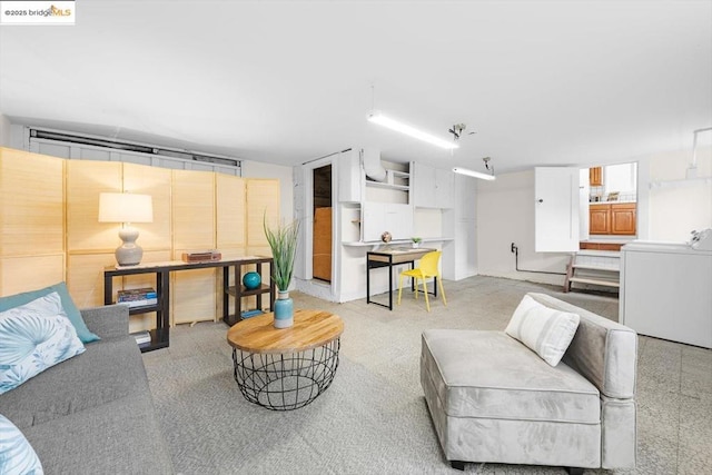 living room with washer / dryer