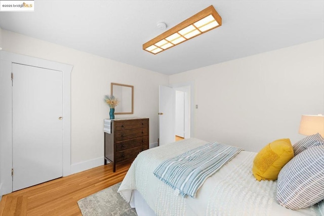 bedroom with hardwood / wood-style flooring