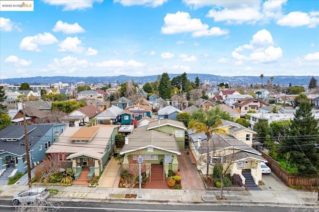 birds eye view of property with a mountain view