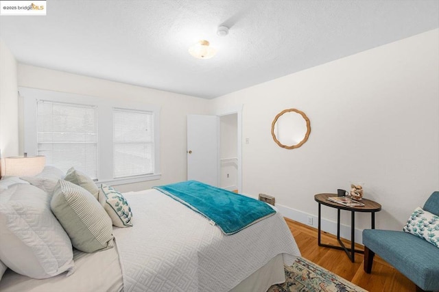 bedroom with light hardwood / wood-style flooring