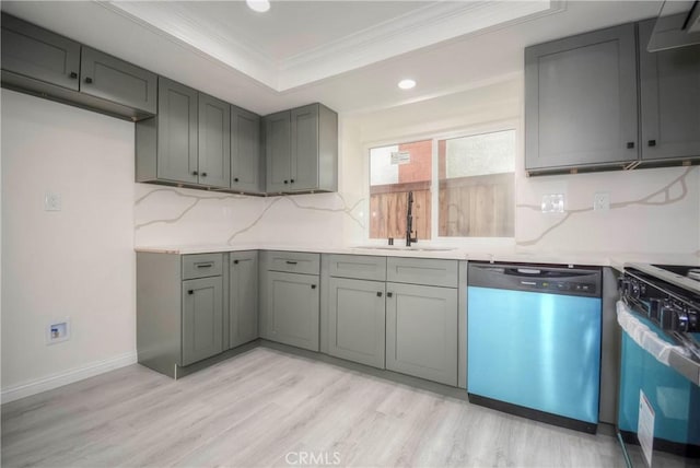 kitchen featuring tasteful backsplash, ornamental molding, stainless steel dishwasher, range, and a raised ceiling