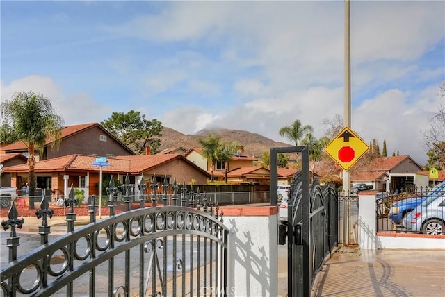 view of gate with a mountain view