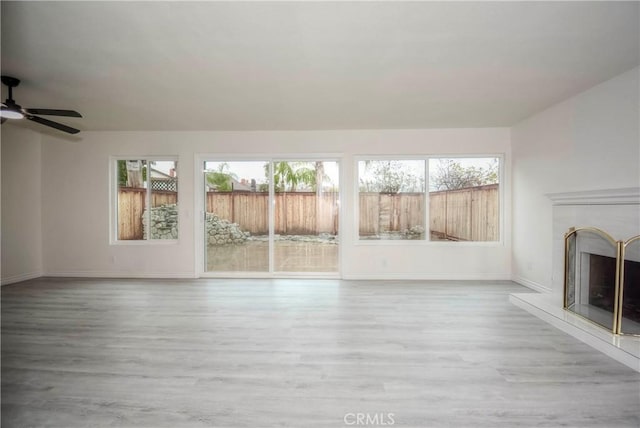 unfurnished living room with light hardwood / wood-style floors